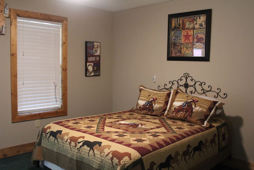 Queen bed located at entrance.