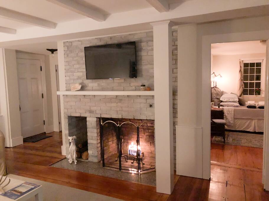 Fireplace / Living Room view from sofa; Bedroom 2 on right