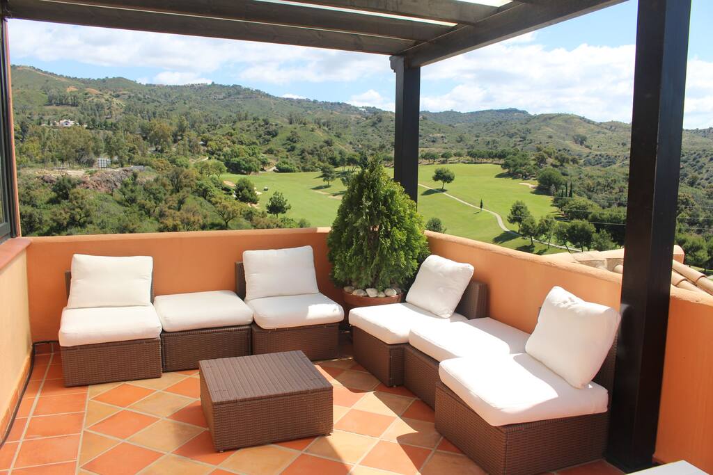 Terrace with golf and mountain views