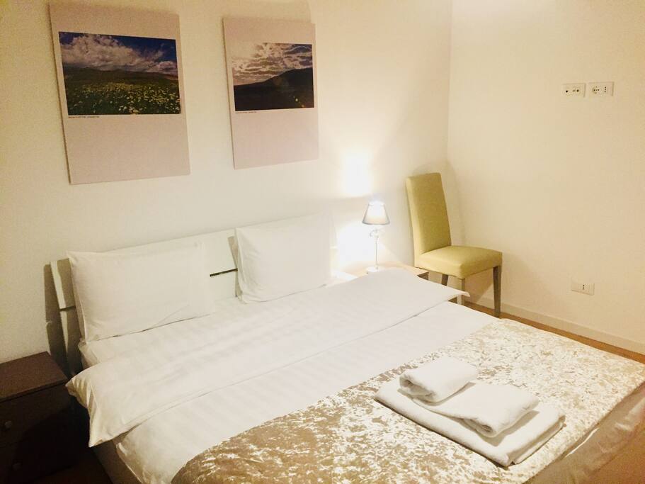 comfortable bedroom, with white linens, furniture from Italy, orthopedic mattress, decor in ethno style
