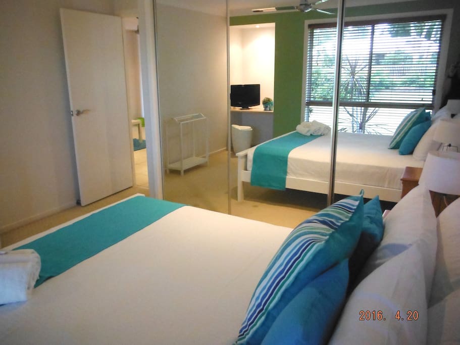 The bedrooms comprise of one room with a Queen bed and another with either a king bed or two single beds.