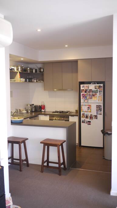 Kitchen has coffee machine, dishwasher and washing machine.