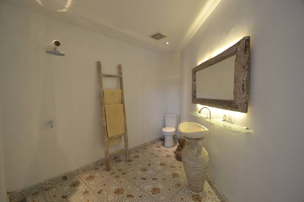 private bathroom with hot shower.