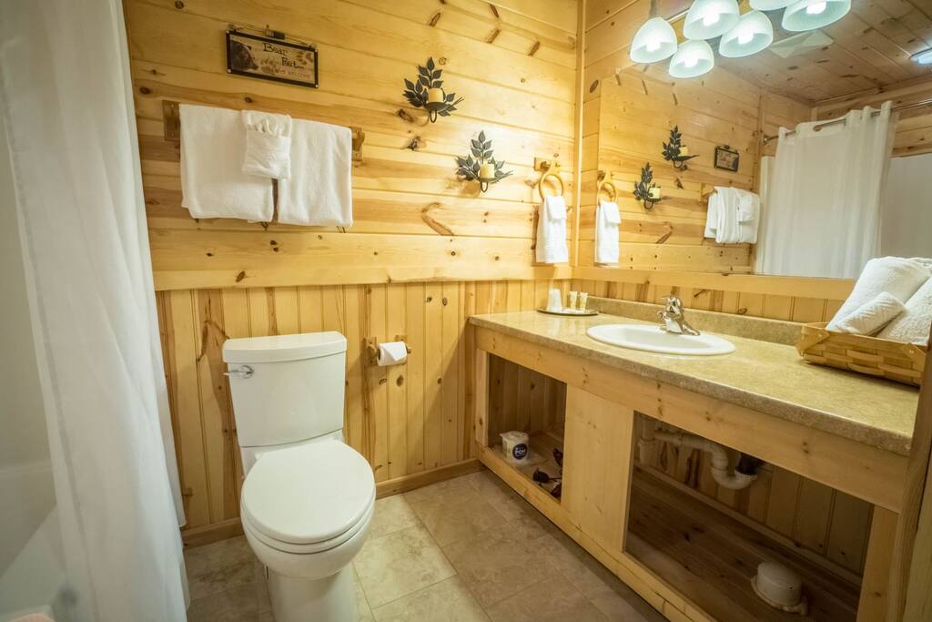 Full bath with tile floors