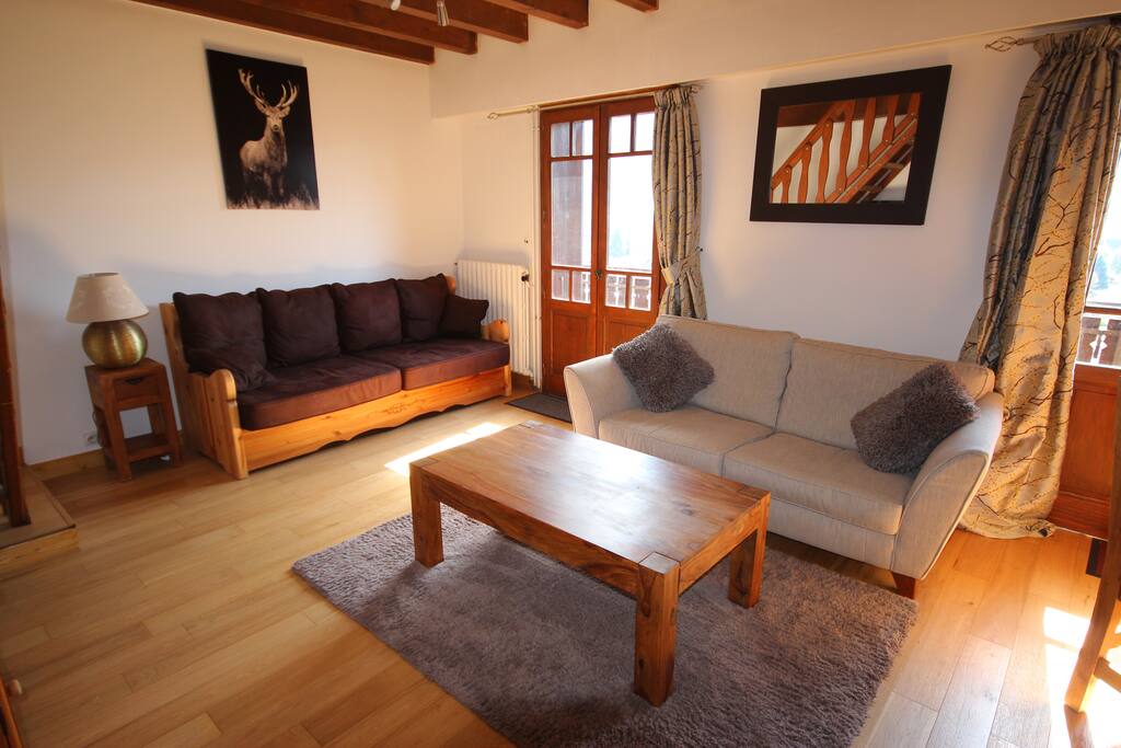 Bright and sunny south facing lounge, door leading to balcony