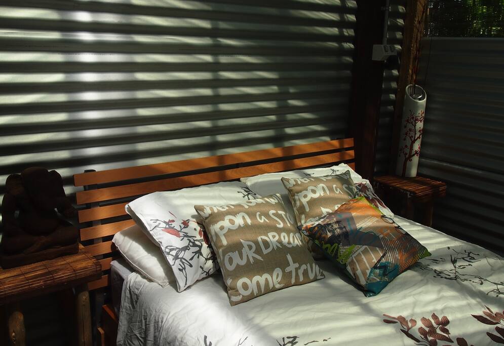 Queen Bed with lounge (which can be another bed for 1 adult or two children top to toe)