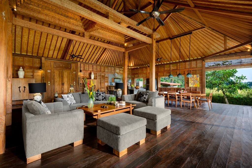 Relax on comfortable sofas in the open plan villa