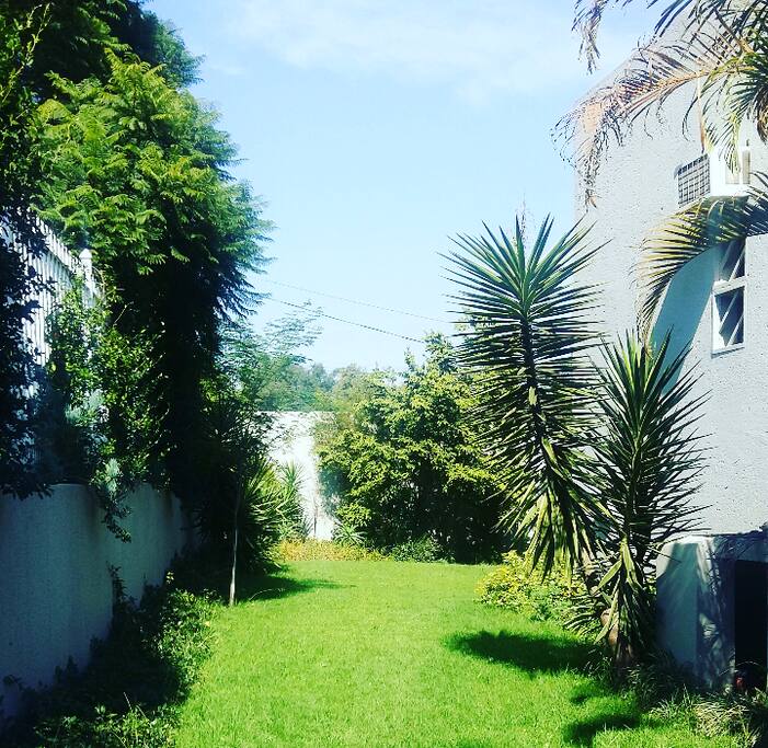 Backyard view from,this area is ideal for picnic set up and South African Braai,all braai essentials available