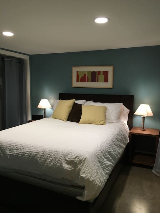 Queen bed, closet with hangers in master.