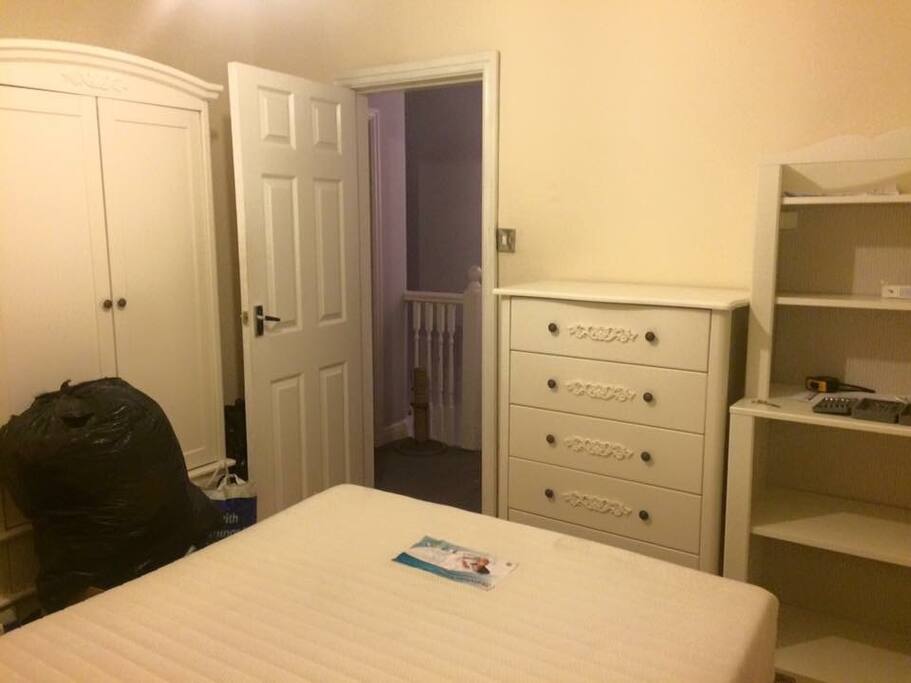 Your double bedroom. Wardrobe, chest of drawers, shelving unit & bedside table.