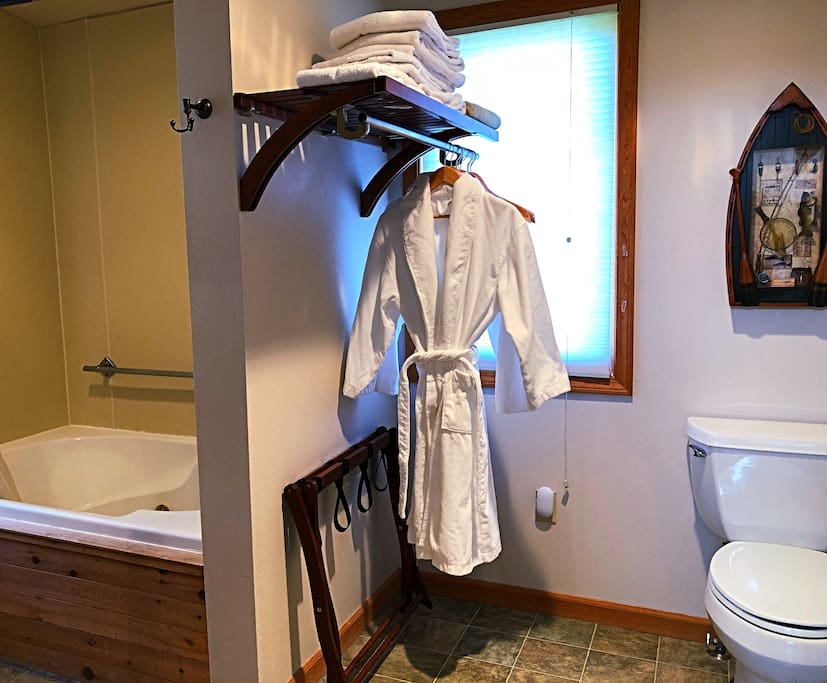 Large bathroom with robes