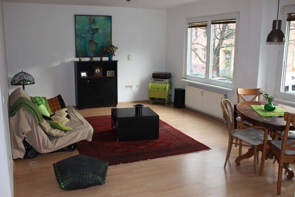 The living room with the dining table.
the sofa open to a queen size bed