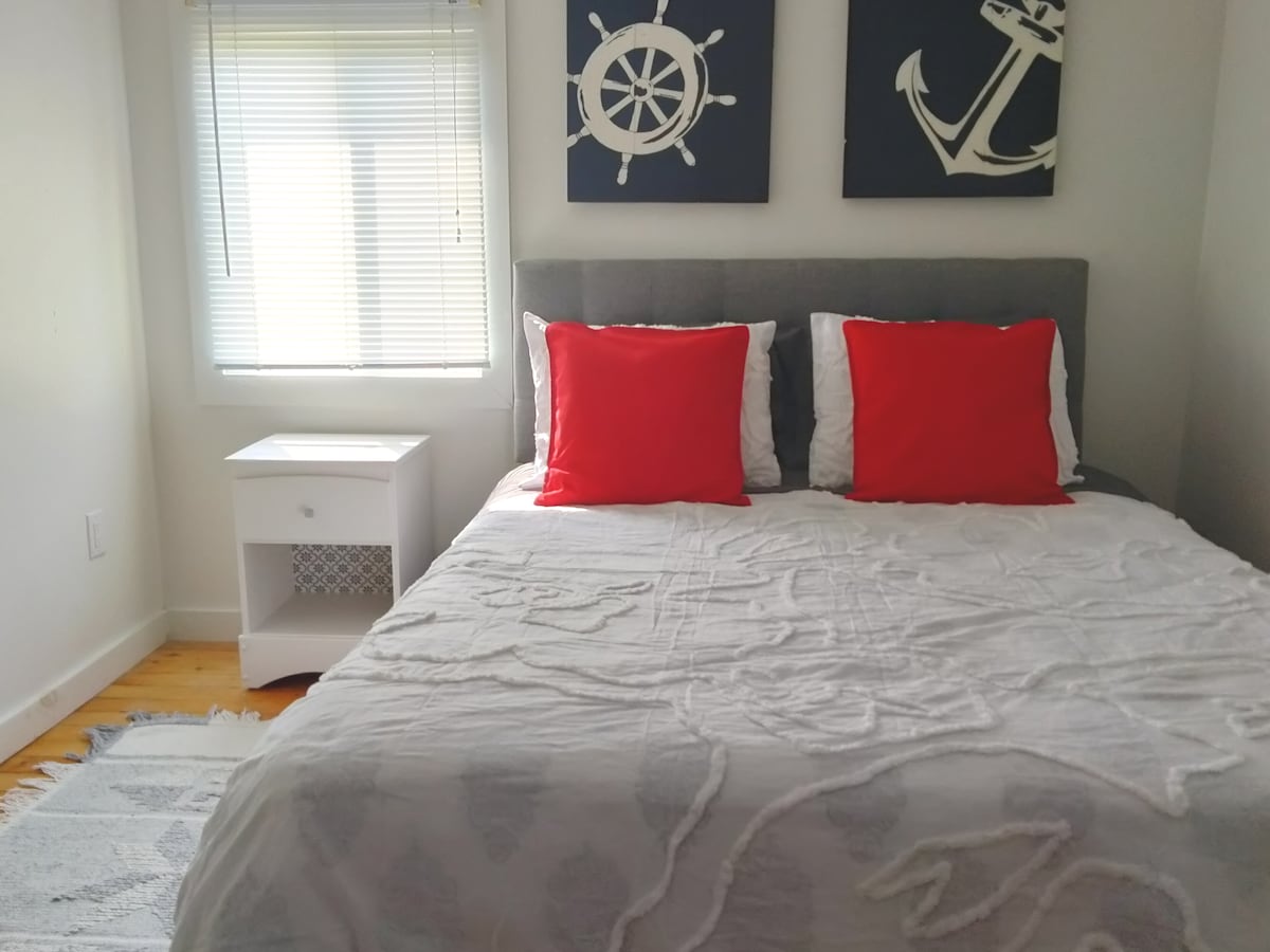 Nautical themed master bedroom to rest and rejuvenate after a busy day exploring many of the attractions in the area or spending time at the beach.  Queen size bed.   
