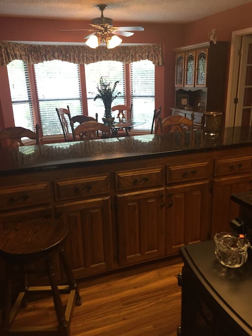 Kitchen is open & bright. Your view is the backyard & pool. Granite countertops, island, glass table for 4,
Stools add more opportunity for dining at the counter.