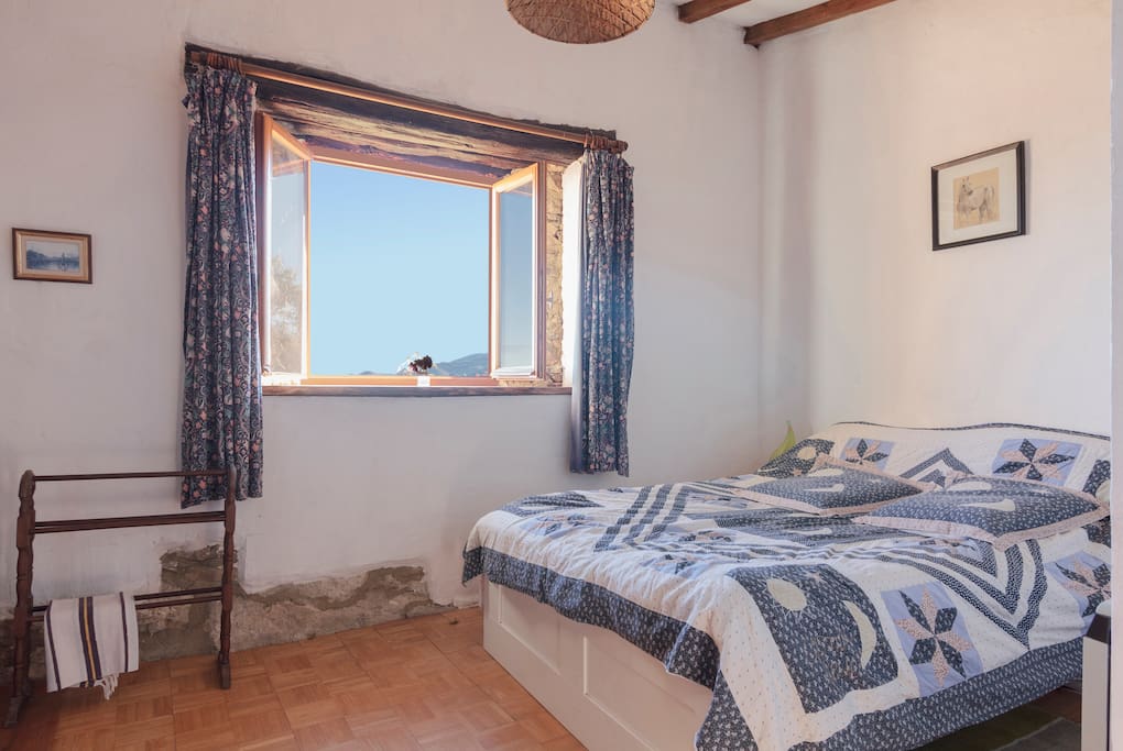 1st Bedroom with double bed and view of Mont Fourcat