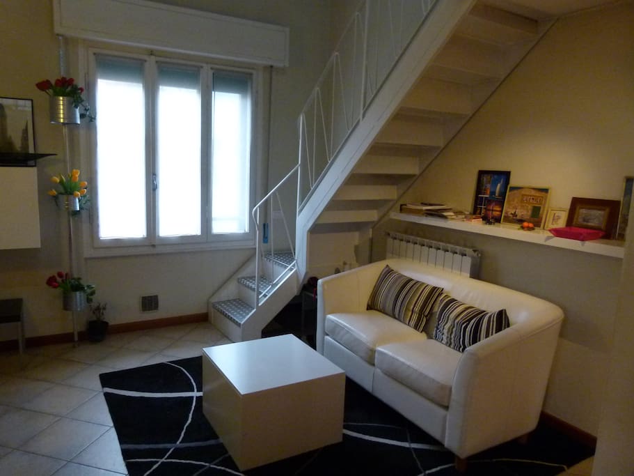 living room and stairs to loft