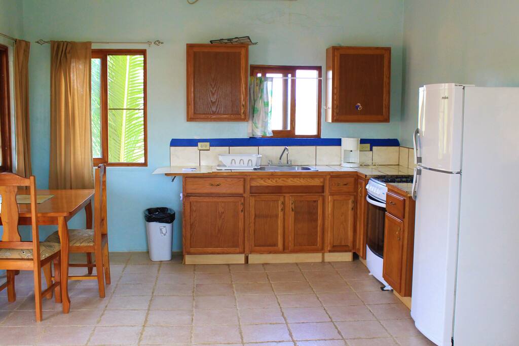 Kitchen with stove, oven, and full size refrigerator
