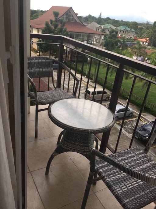 the balcony (parking and clubhouse on the background)