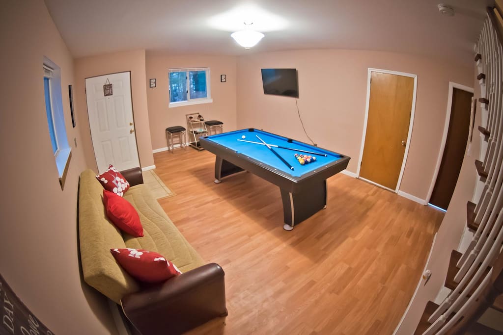 Lower Level Game Room with Pool Table and a Cozy Couch