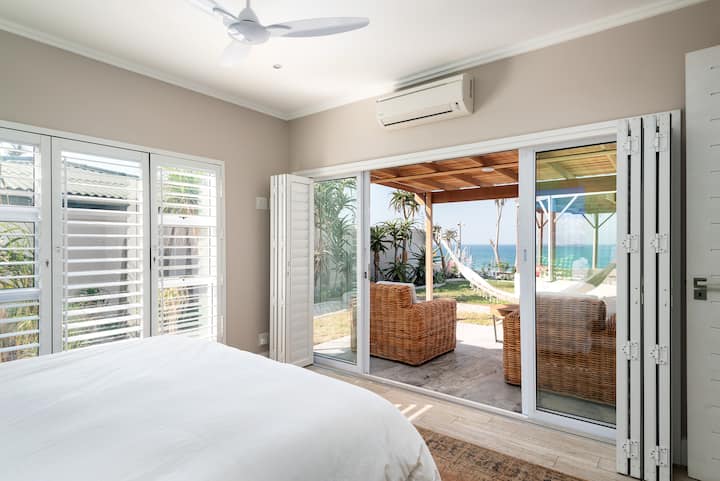 Third bedroom view of private patio, hammock, garden & ocean.