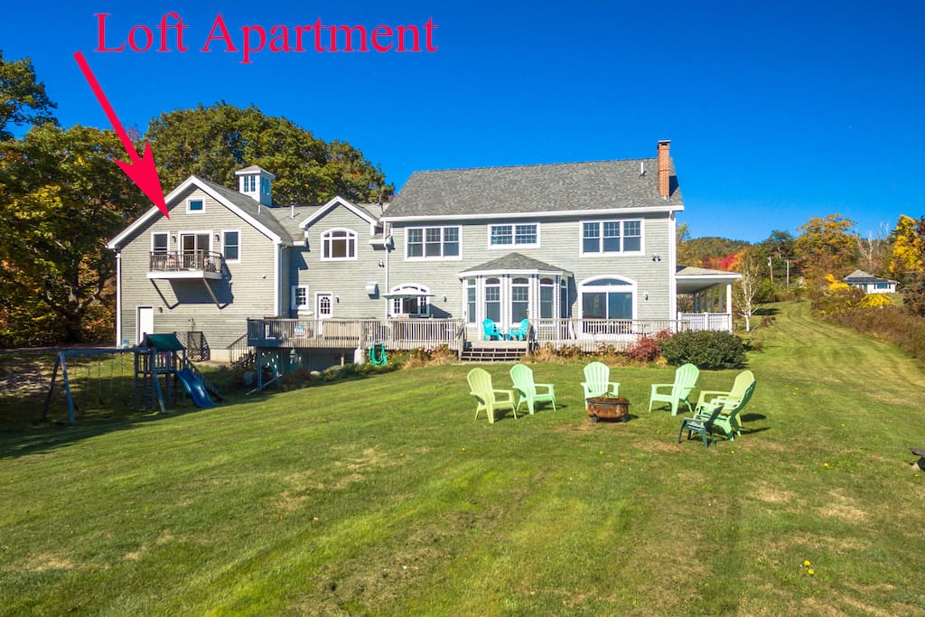 Gently sloping and grassy lawn area leading to private beach area. Enjoy evening fires outside on beach or in firepit and watch the moonrise and stars.