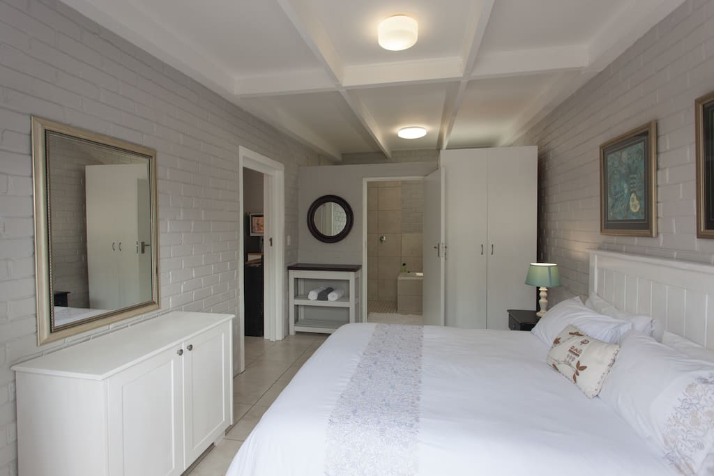 Spacious main bedroom with double-door leading to your own private courtyard. En suite bathroom. Plenty of cupboard space. Fresh linen.