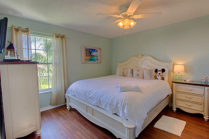 Escape to the Cocoa Beach Room after a long day at the Parks!