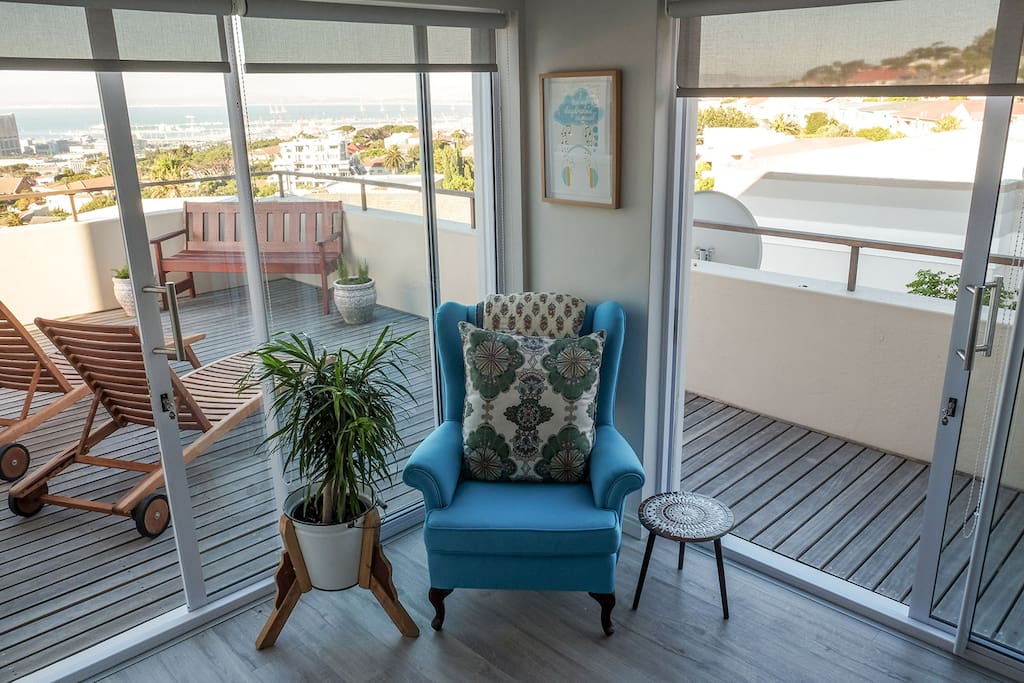 A place to sit in the master bedroom. Opening up onto a wrap around balcony with sun chairs.
