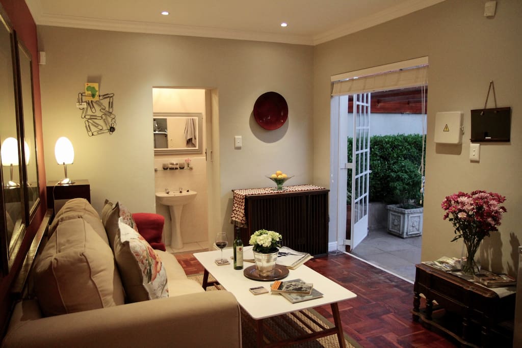 The lounge is spacious and opens onto a pink sandstone breakfast patio
