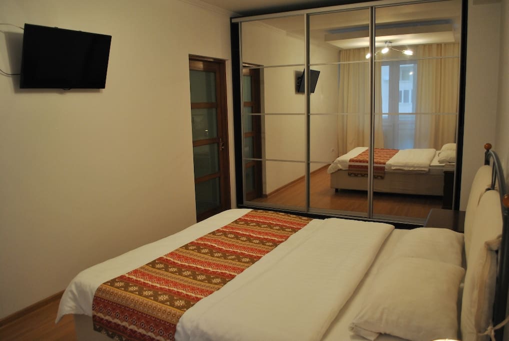 first bedroom with tv
