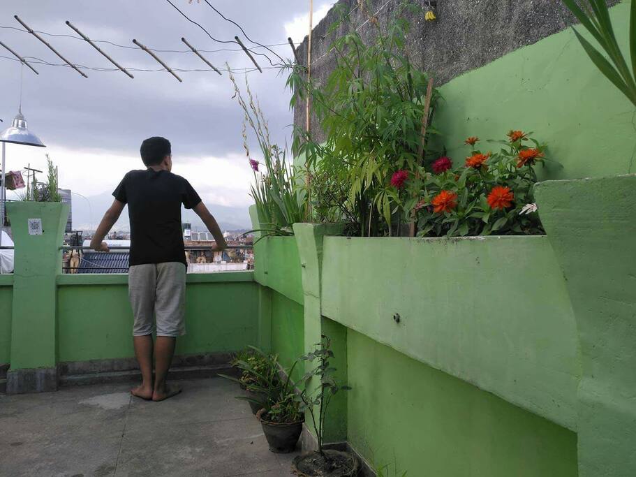 Roof top terrace garden with open shower area(not seen in photo), rest area(table/chair), and a wide range view of himalayas and patan durbar squarr
