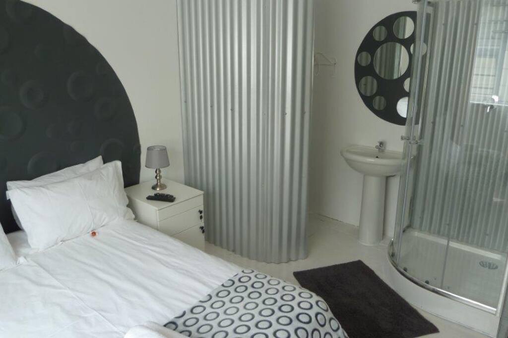 Bed and bathroom area