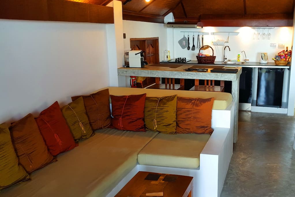 Open-planned living area, breakfast bar and kitchenette