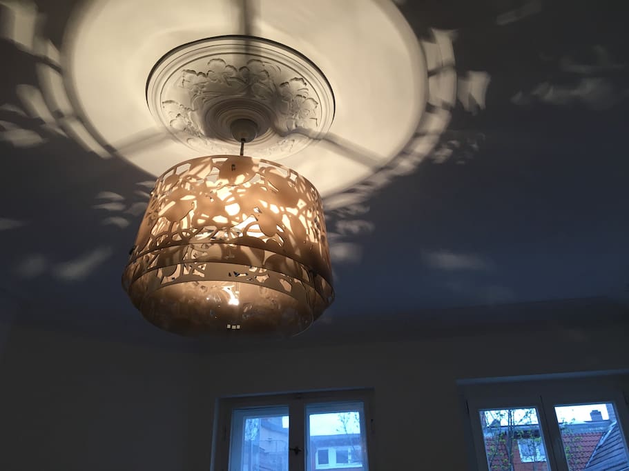 Designer lamp; ceiling decorated with original stucco