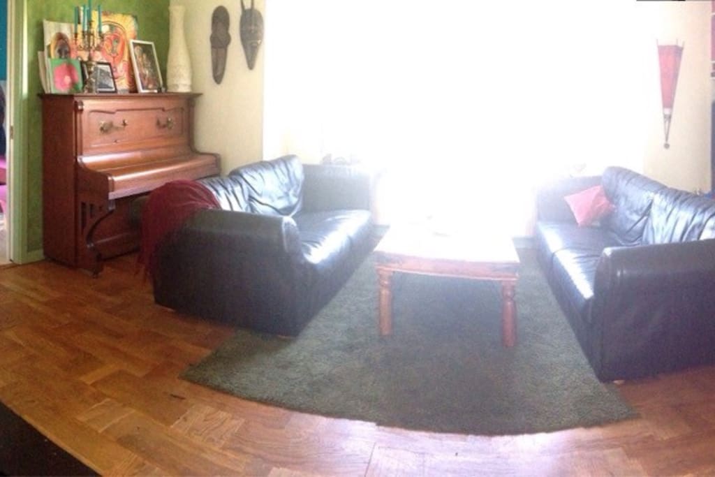 Livingroom with sofas for chilling and wooden stove for cold nights.