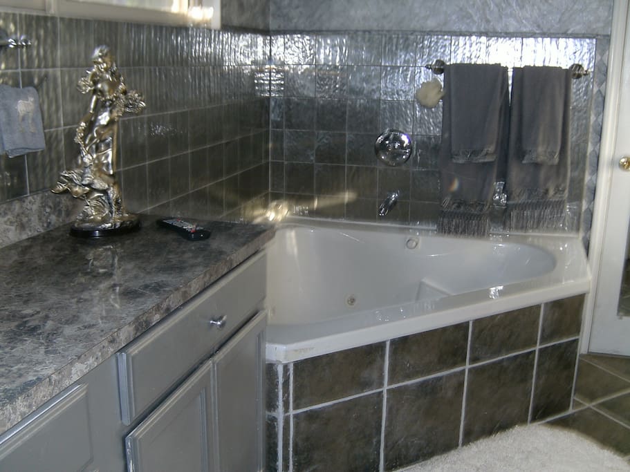 Your private bathroom with jacuzzi tub and separate shower.