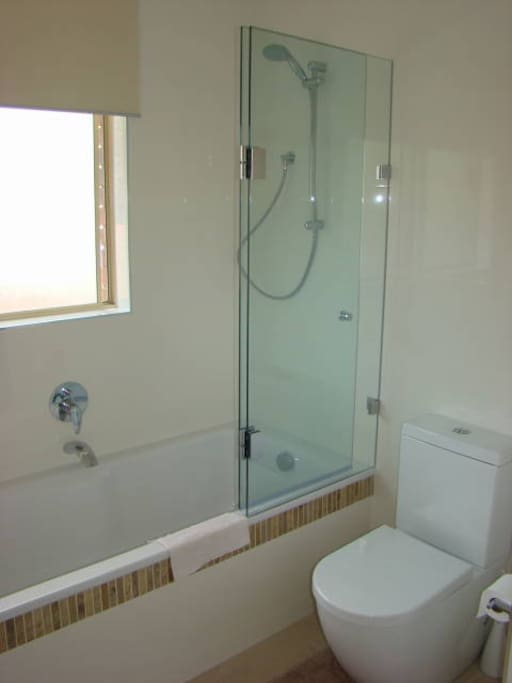 Brand new modern bathroom with bath & shower