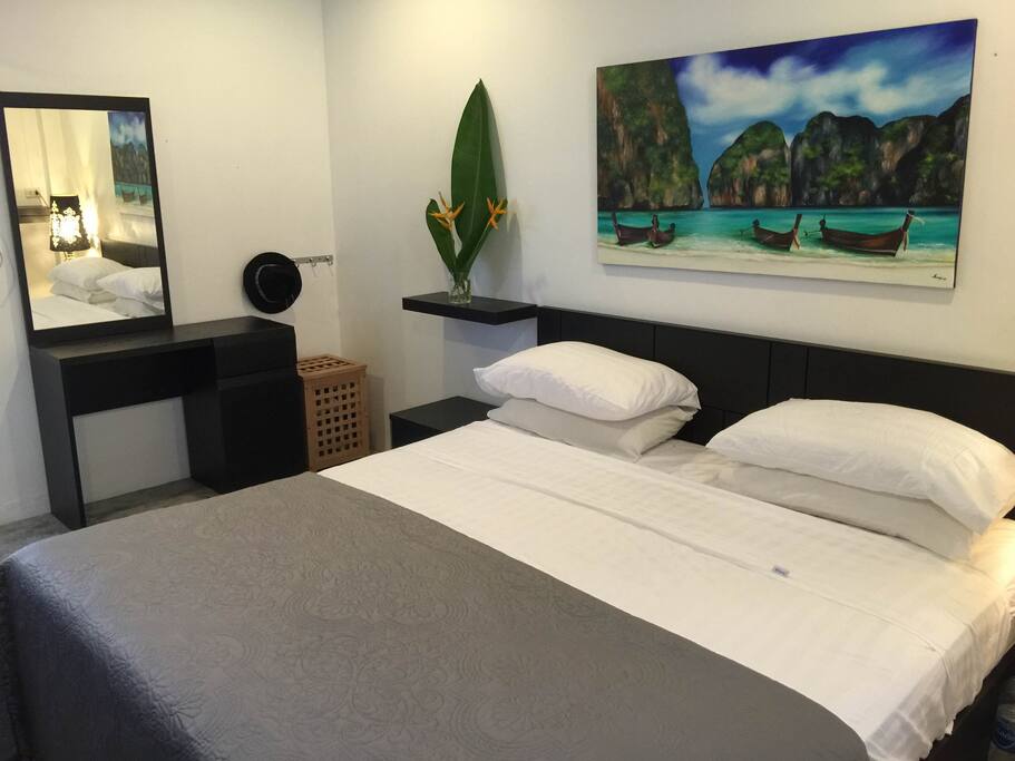 Main Bedroom complete with King sized bed, air conditioning, fans and wardrobes