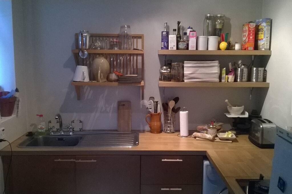 Small kitchen with dishwasher & washer/dryer.