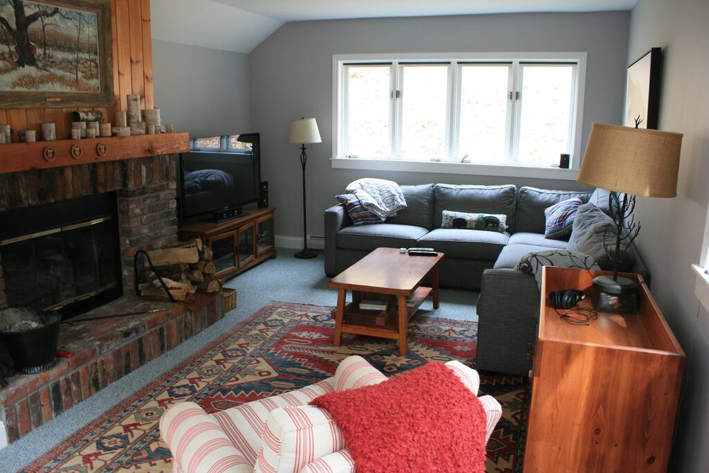 Spacious living room with fireplace and 47" TV with DVD