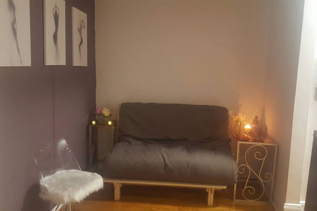 Living area with futon that can be converted into a comfortable bed for 1 or 2 people.