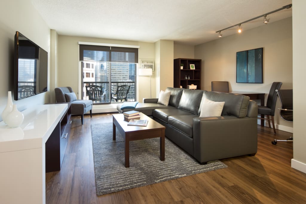 Living and dining area with 60" Smart TV