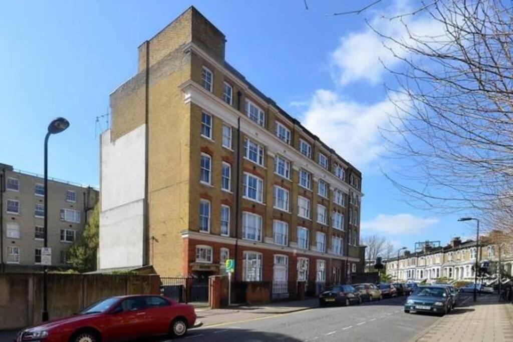 The building from Sylvester Road and communal garden behind.