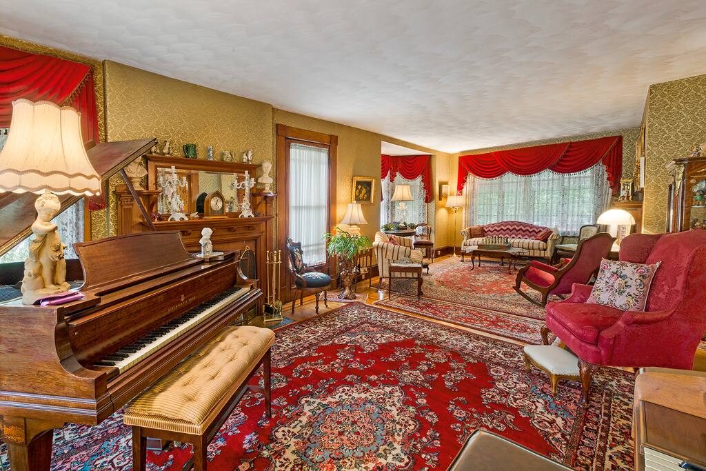 Our living room offers two fireplaces, a grand piano, and an organ.