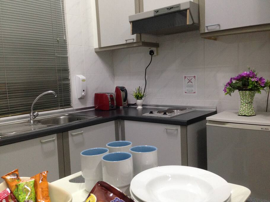 kitchenette with all basics utensils needed; toast, kettle and stove