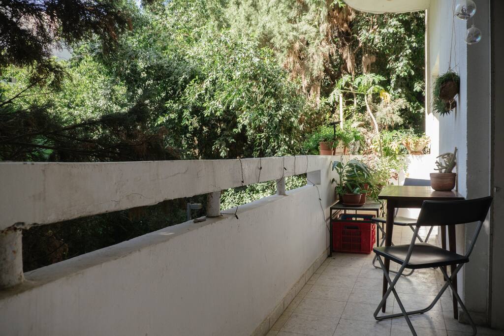 Private balcony, drenched in green