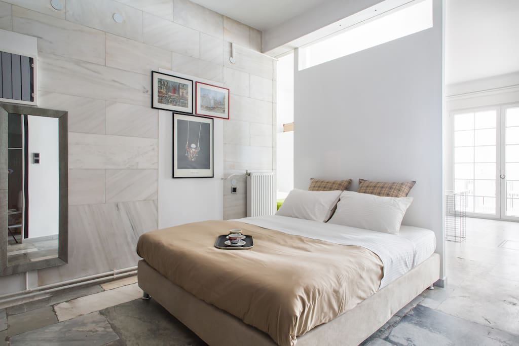 Master bedroom with Queen-sized double bed and large guest wardrobes.