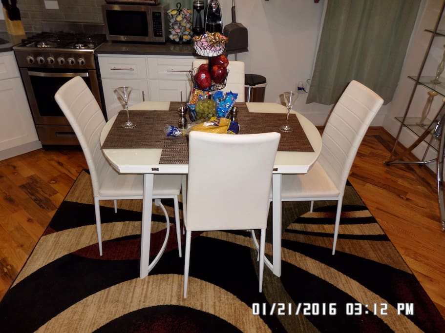 Modern dining table, can open with two extensions, free Fruits, soft drinks, coffee and tea.