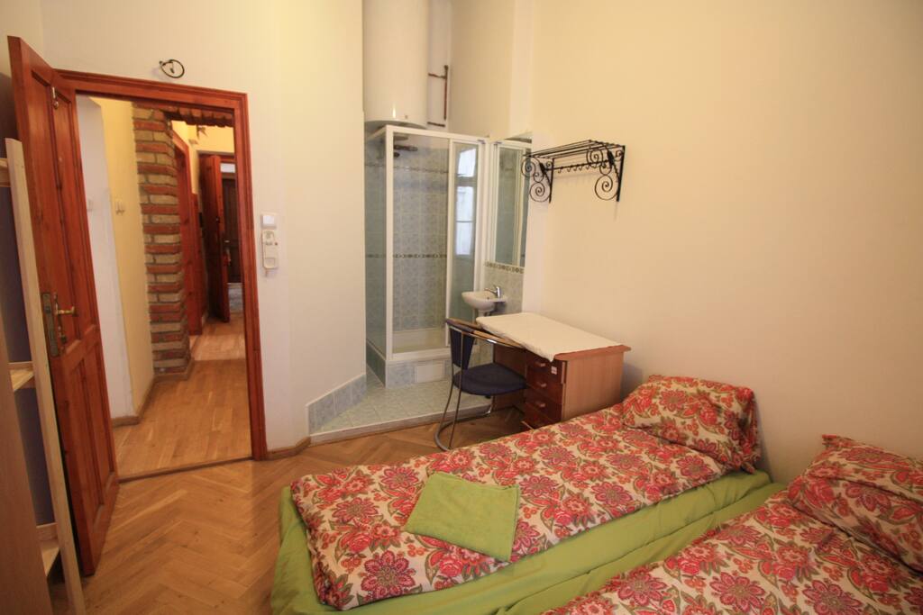 bedroom B , 2 beds ,writing desk, wardrobe, shower unit , ideal for couples