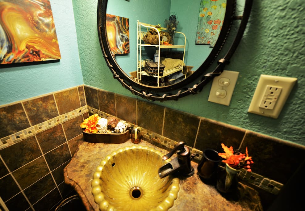 Semi-private bathroom is reserved for guests and is shared between two guest bedrooms